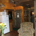 The kitchen, complete with dining area, dishwasher, gas stove, refrigerator, microwave, toaster, kitchen utensils and cook ware.